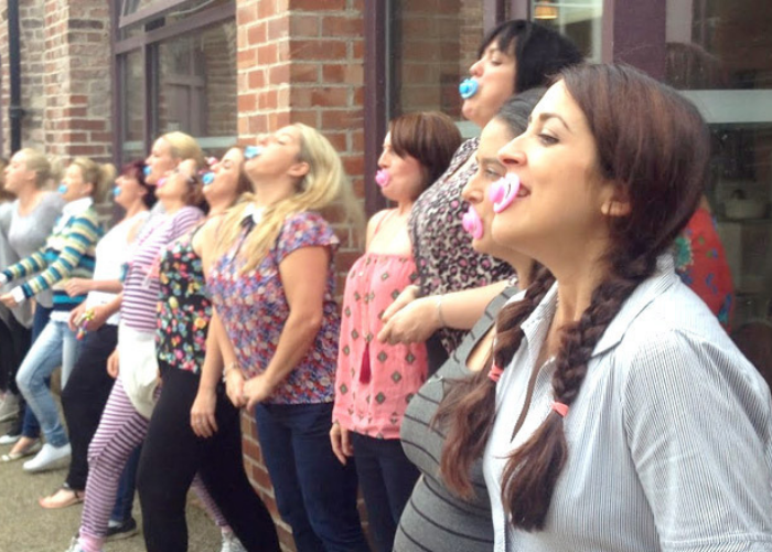 Baby shower games - Women with pacifiers